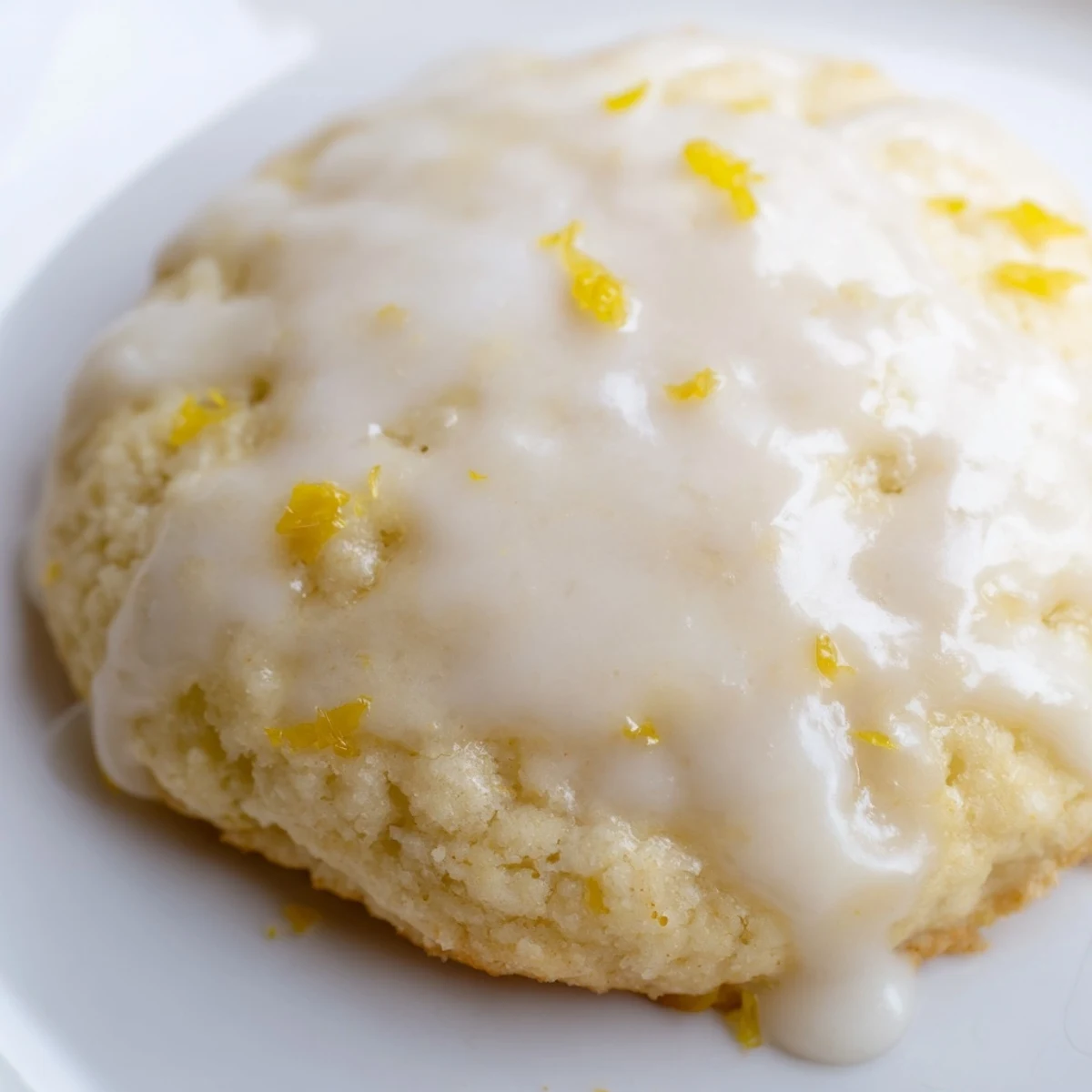 Stack of soft Lemon Ricotta Cookies with bright yellow glaze, perfect with afternoon tea.